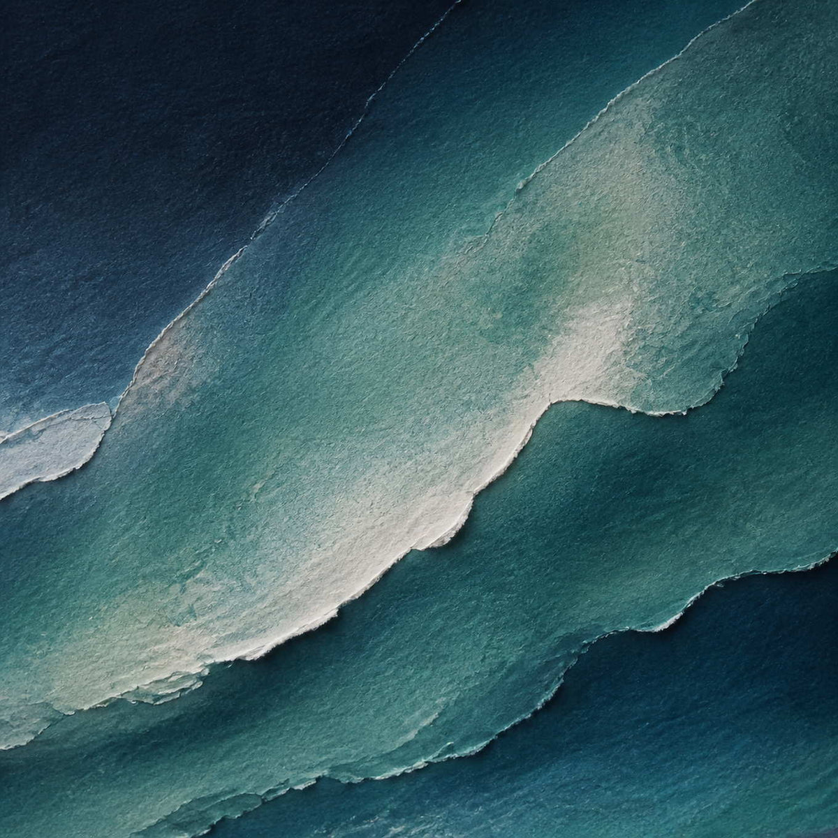 Close-up of layered navy, teal, and white painted texture.