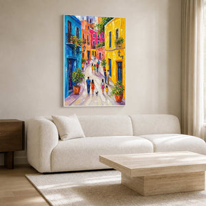 Colorful textured cityscape wall art displayed above a clean white living room sofa.