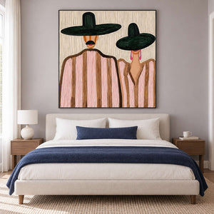 Two-hat portrait over a cream bed with navy throw and matching accent cushion.