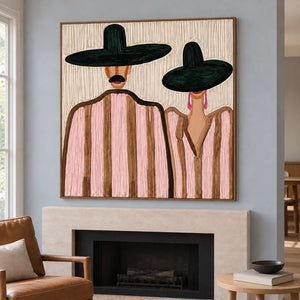 Green-hat pair painting above a pale fireplace on a blue-gray wall.