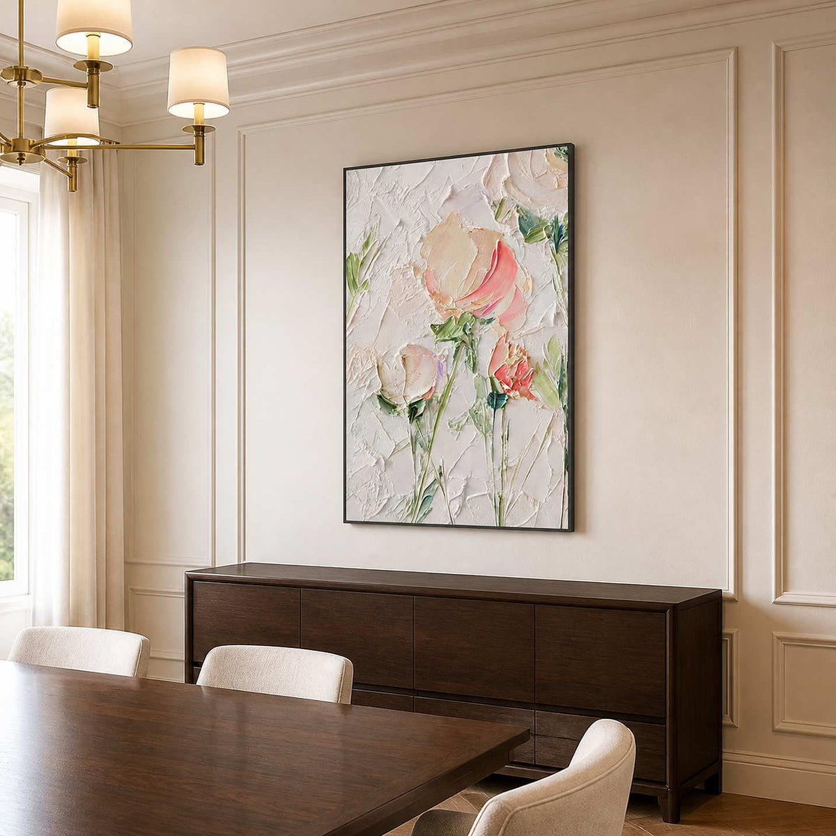 Black framed floral artwork above a dark sideboard beside a wooden dining table.