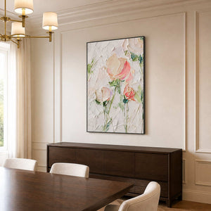 Black framed floral artwork above a dark sideboard beside a wooden dining table.
