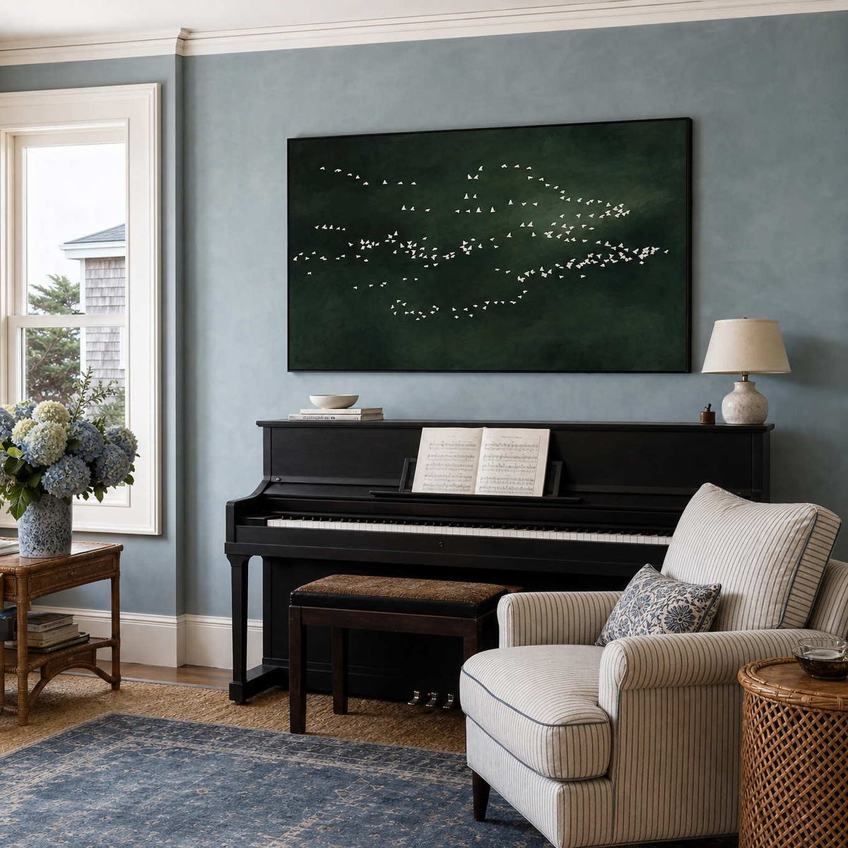Minimalist bird canvas displayed above a coastal music room piano.