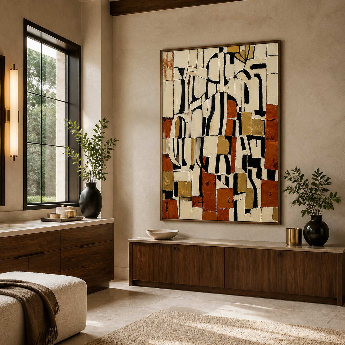 Wood framed cream and rust abstract painting beside a vanity in a bathroom dry area.