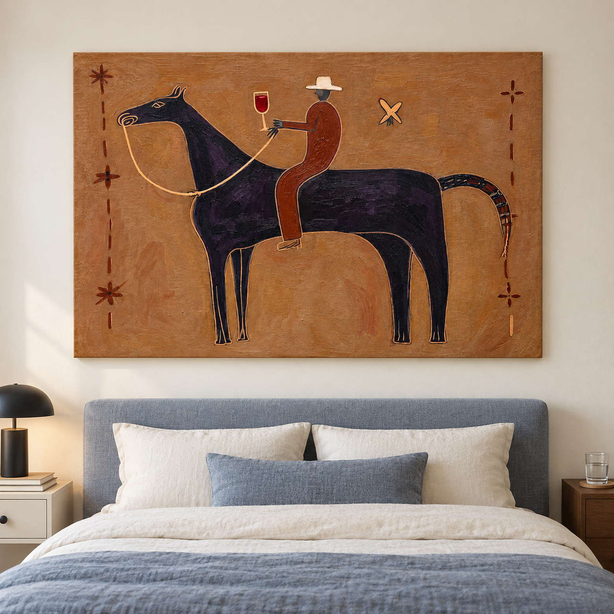 Ochre equestrian artwork above a blue upholstered bed.