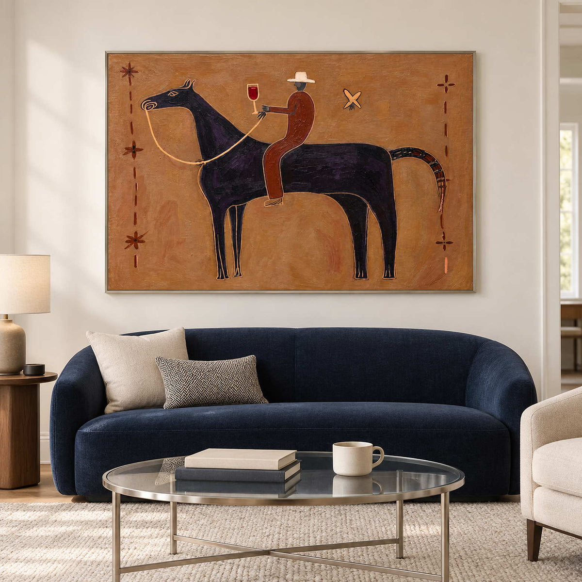 Ochre horse-and-rider painting above a curved navy sofa.