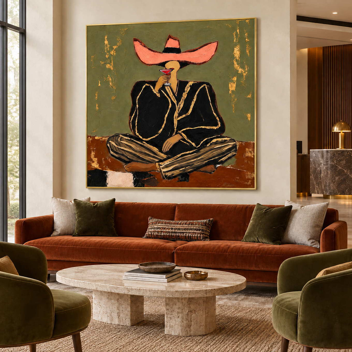 A Toast to Freedom in a gold frame above a rust sofa with green armchairs and a round stone table in a lobby.
