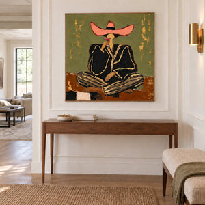 A Toast to Freedom in a wood frame above a slim hallway console against white wall paneling.