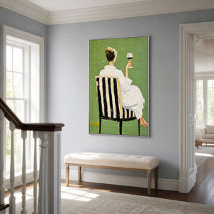 Silver framed green figurative painting above a pale bench beside a wooden stair railing.