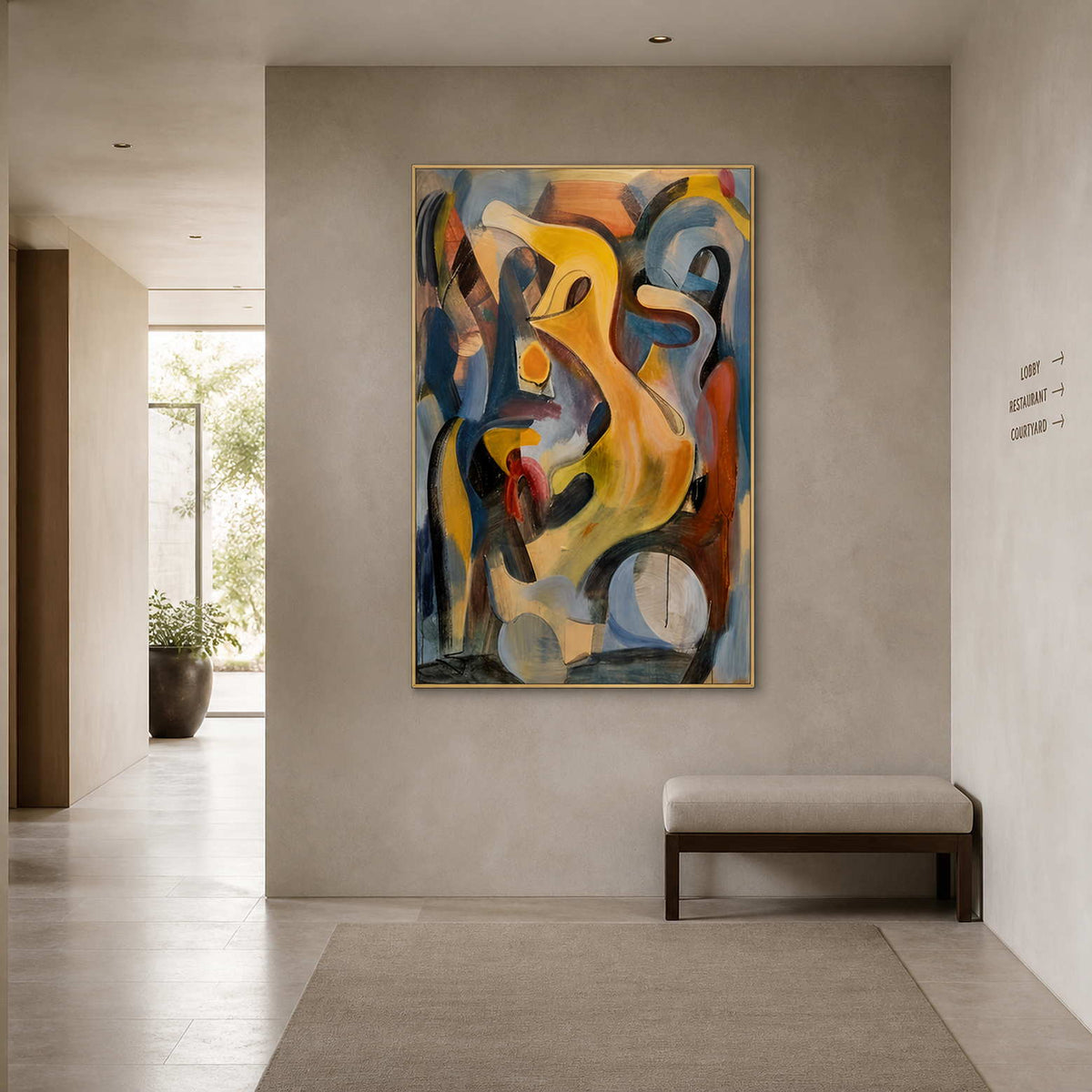 Gold framed yellow and blue abstract painting above a bench in a hotel gallery.