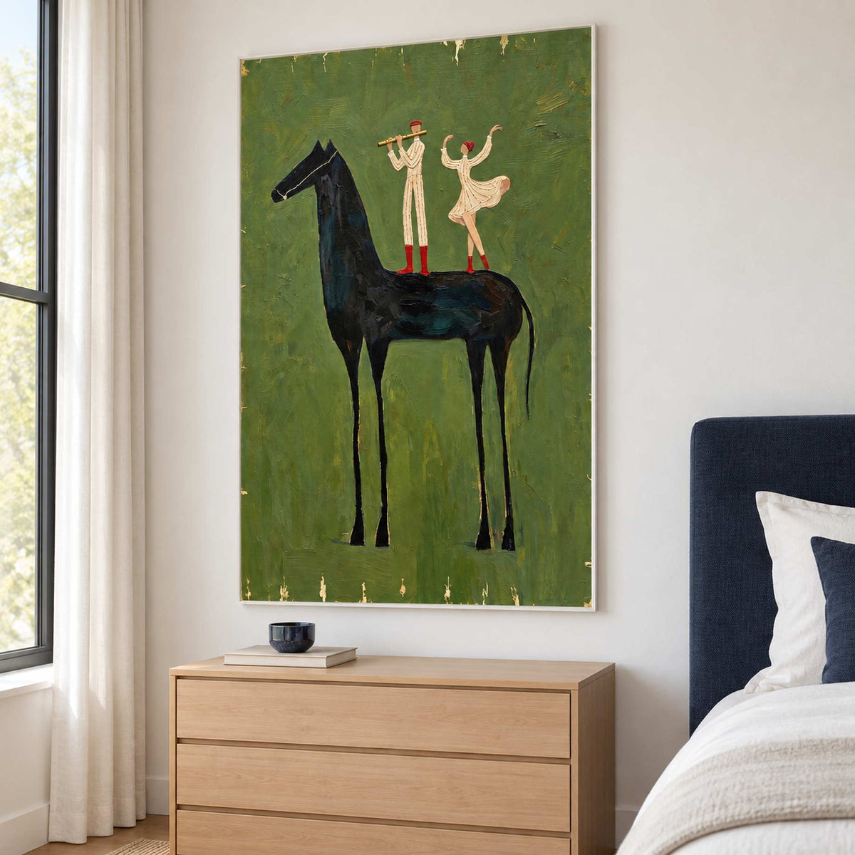 Tall black-horse artwork above a light wood bedside chest next to a navy bed.