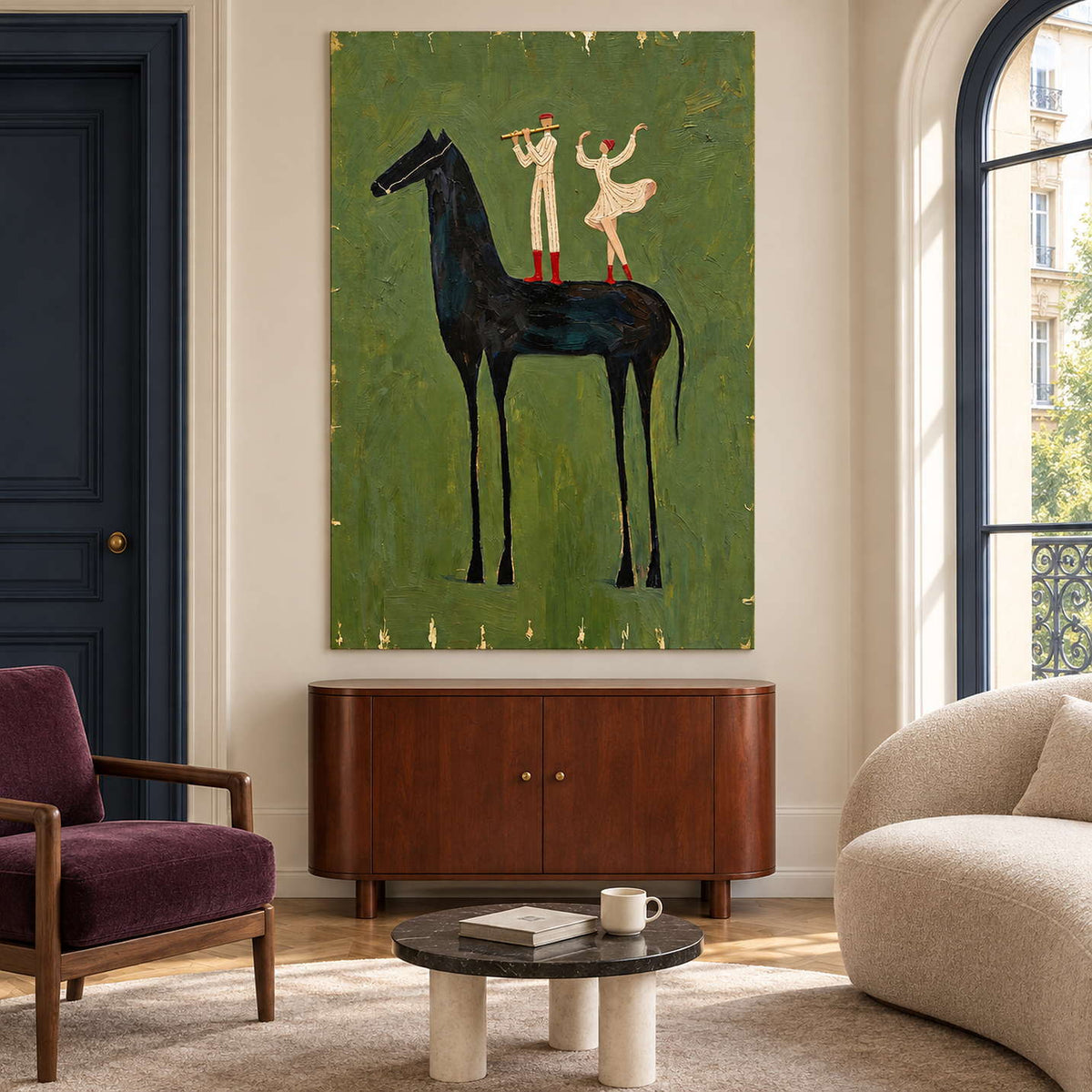Horse and performers artwork above a brown cabinet between a burgundy chair and cream sofa.