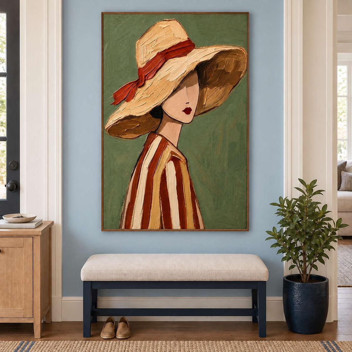 Tall green portrait over a cream entryway bench beside a dark planter.