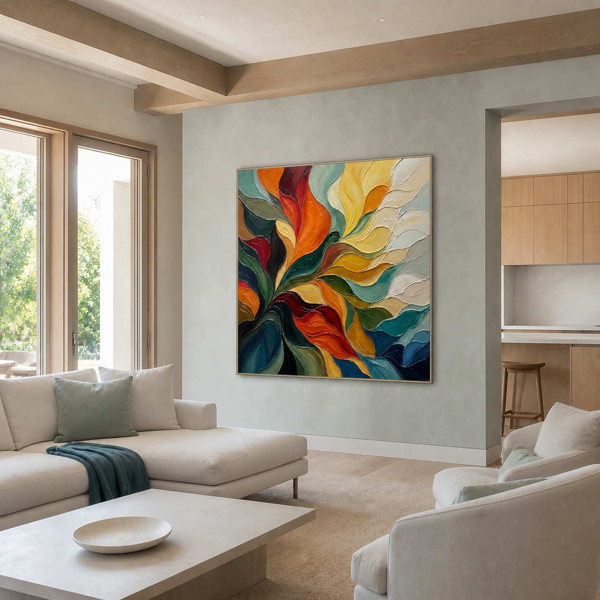 A Warm Embrace in a silver frame on a blue-gray wall in a sunlit lounge with cream seating.