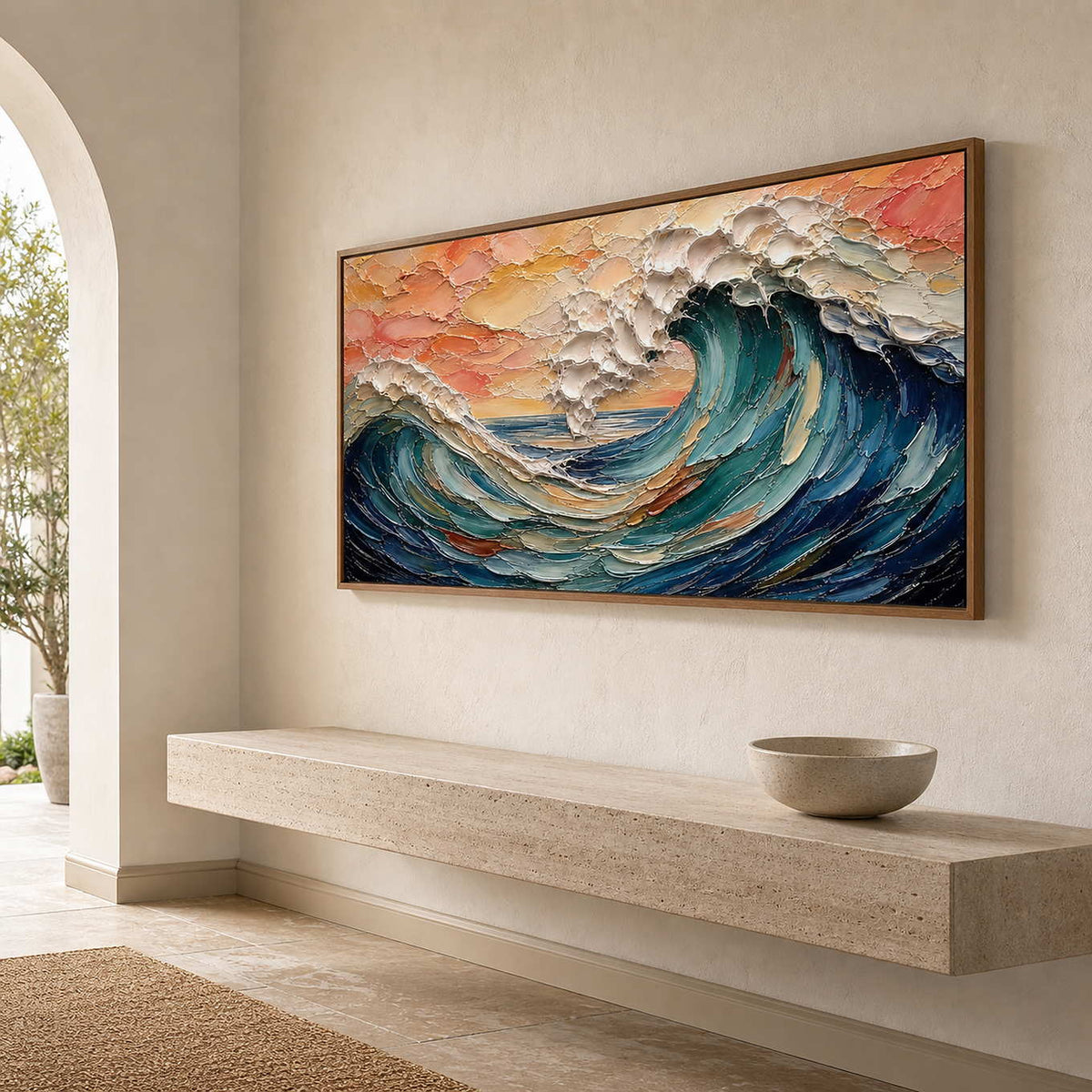 Coral and teal wave painting above a limestone entryway console.