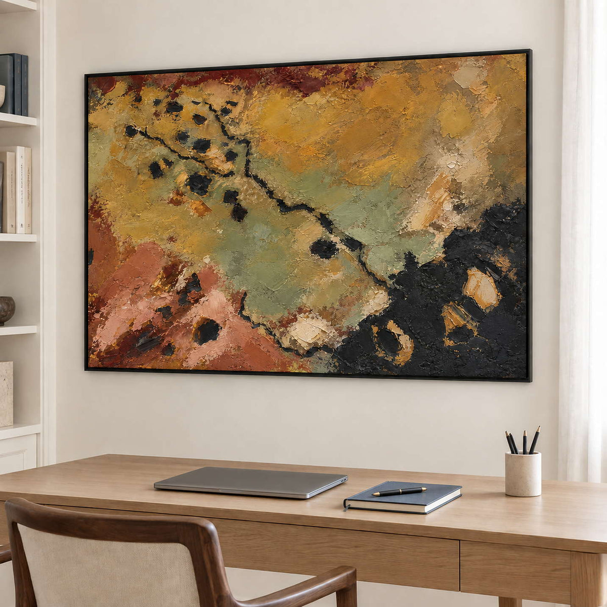 Weathered ochre, moss green and rust tones crossed by dark marks in a black frame, displayed in a home office.
