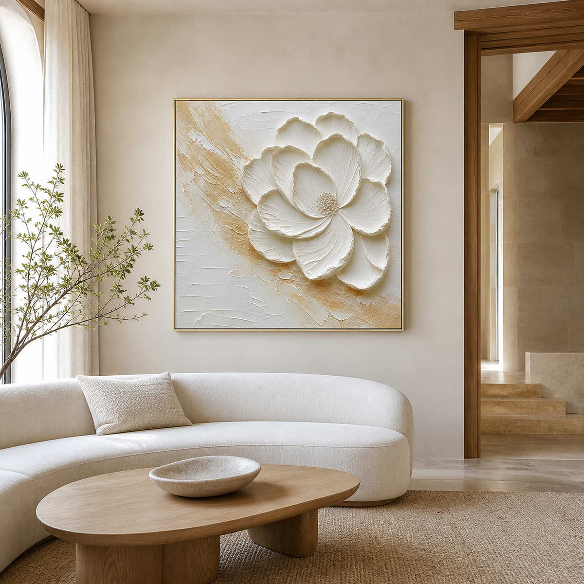 Sculptural white floral wall art displayed in a warm ivory living room.