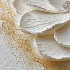 Close-up of layered white petals and softly brushed gold texture.