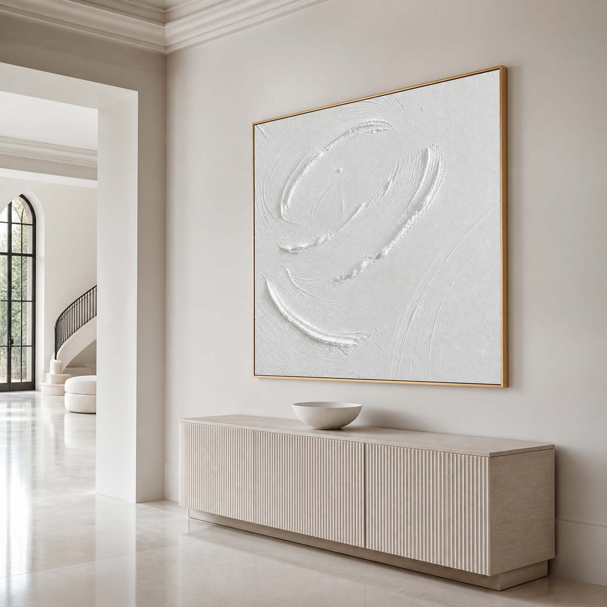 Sculptural white abstract wall art displayed in an elegant luxury entryway.