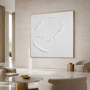 Textured white minimalist wall art displayed in an upscale hotel lobby.