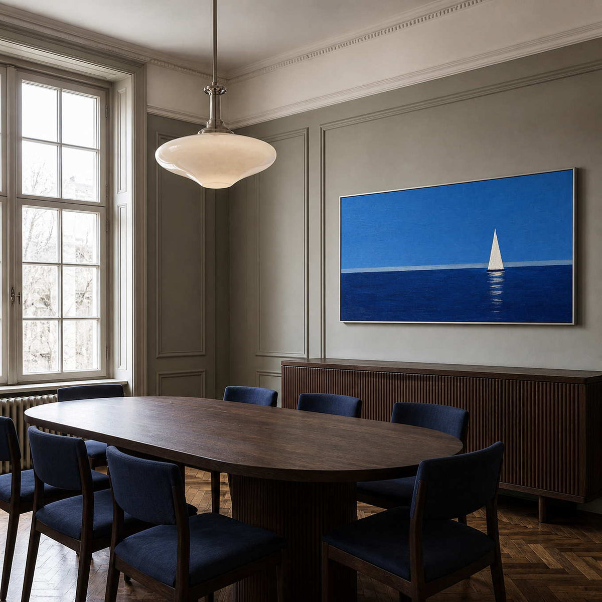 Blue sailboat wall art displayed in an elegant formal dining room.
