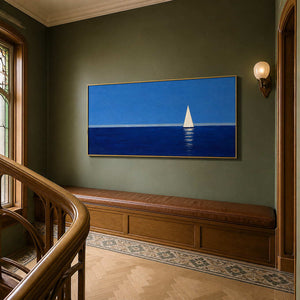 Blue sailboat wall art displayed on an elegant residential stair landing.