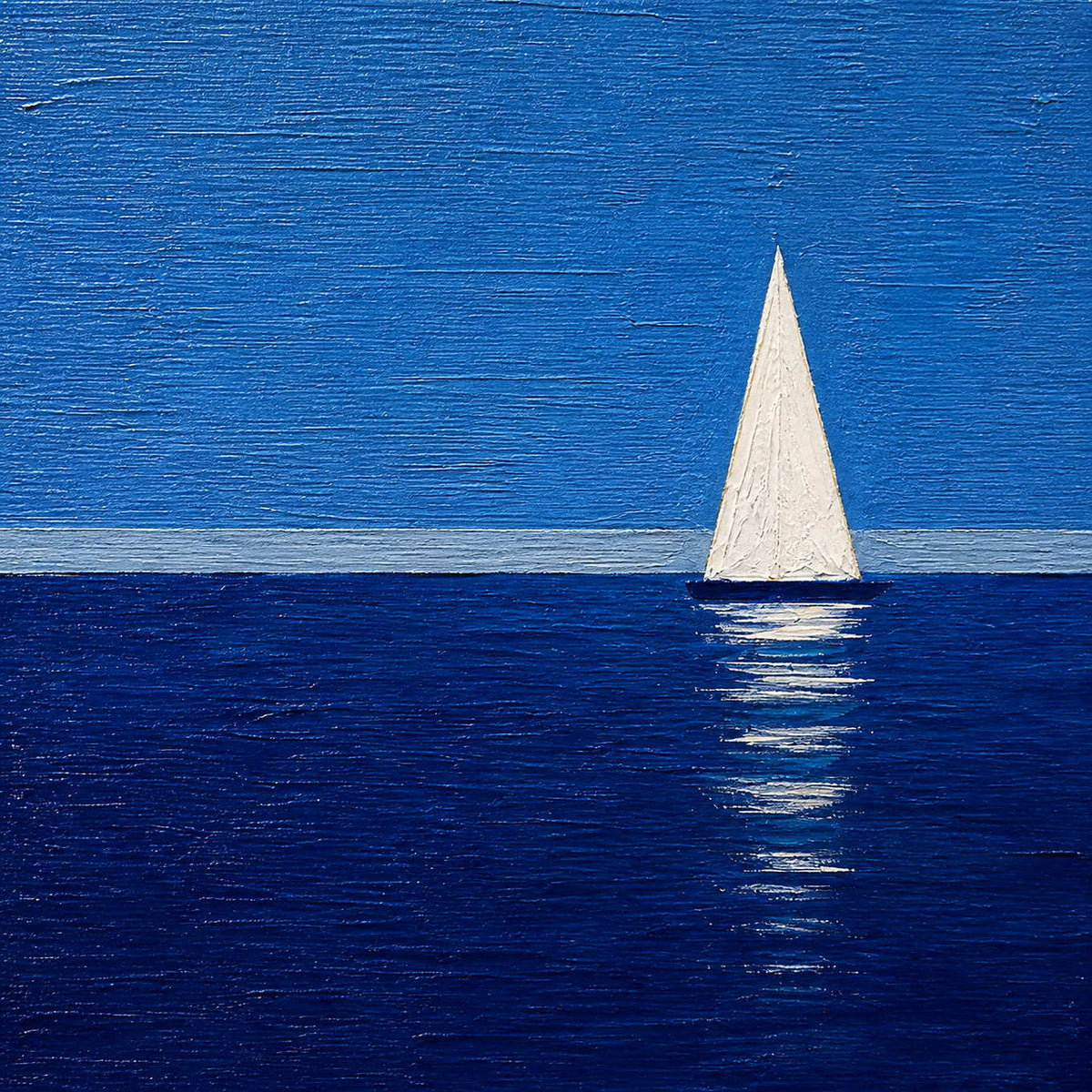 Close-up of raised blue texture and an ivory painted sailboat.