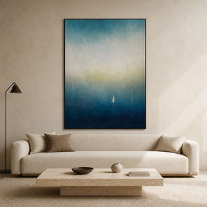 Misty blue coastal wall art displayed in a serene modern living room.