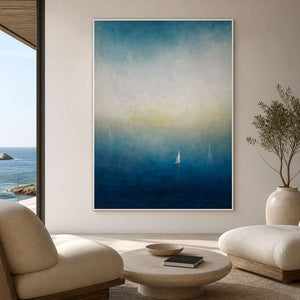 Blue coastal sailboat artwork displayed in a luminous ocean-view lounge.