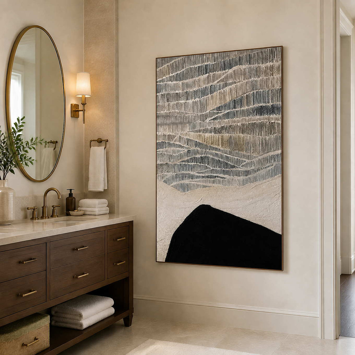 Wood framed textured abstract artwork beside a stone vanity in a bathroom dry area.