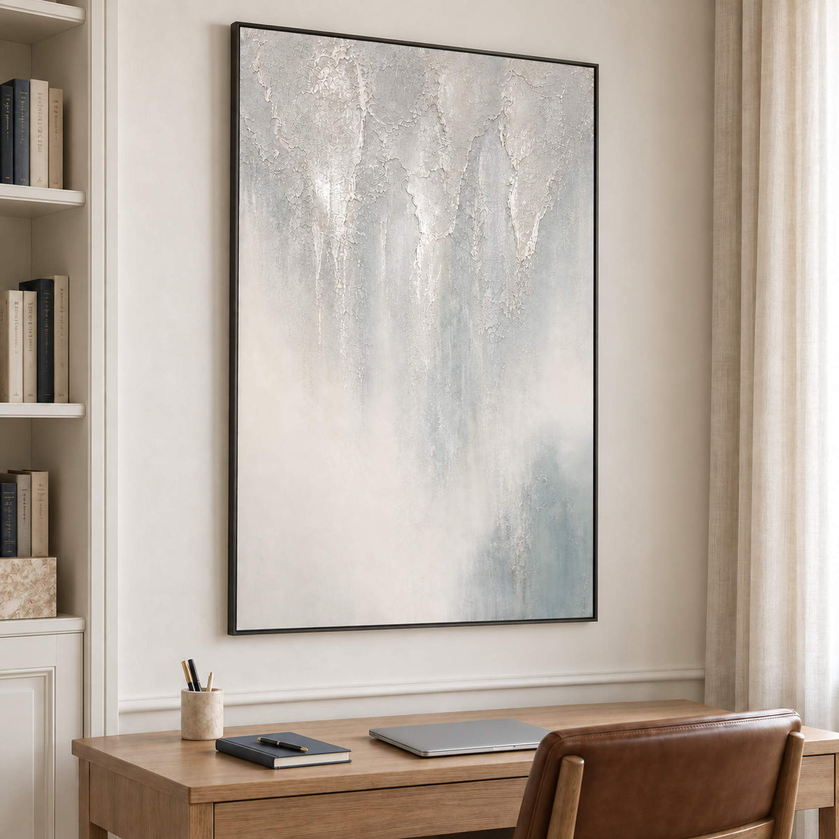 Soft gray and ivory vertical textures fading into pale blue in a black frame, displayed in a home office.