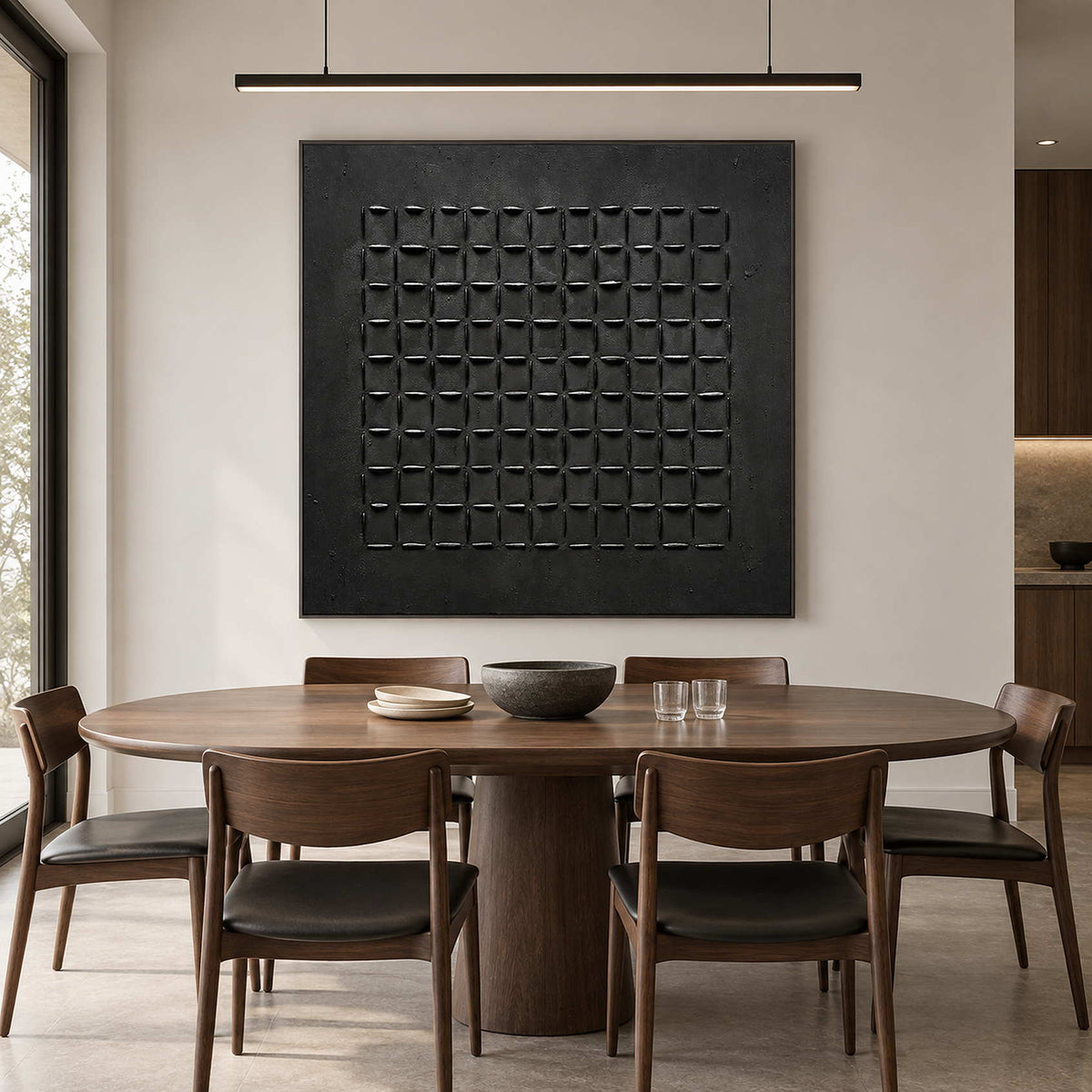 Raised black grid painting above a round wood dining table with dark-seat chairs.