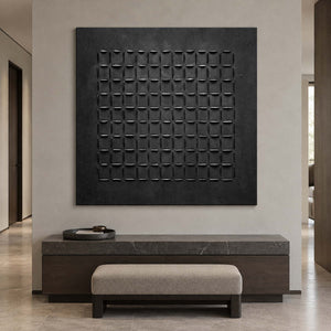 Square black grid art above a dark stone-topped console and pale upholstered bench.