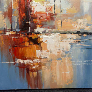 Close-up of cream and amber layered marks meeting a thin dark line over blue.