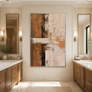 Silver-framed abstract wall art between two vanities in a neutral bathroom.