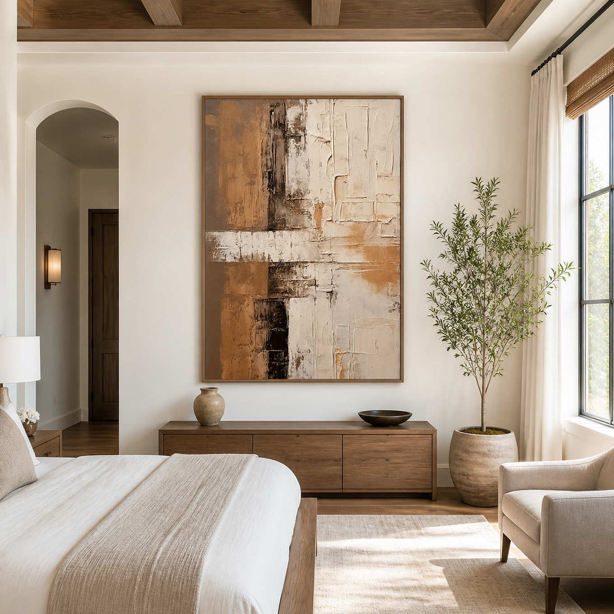 Wood-framed ochre abstract wall art above a dresser in a calm bedroom.