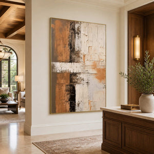 Gold-framed ochre abstract wall art beside a wooden hotel reception counter.