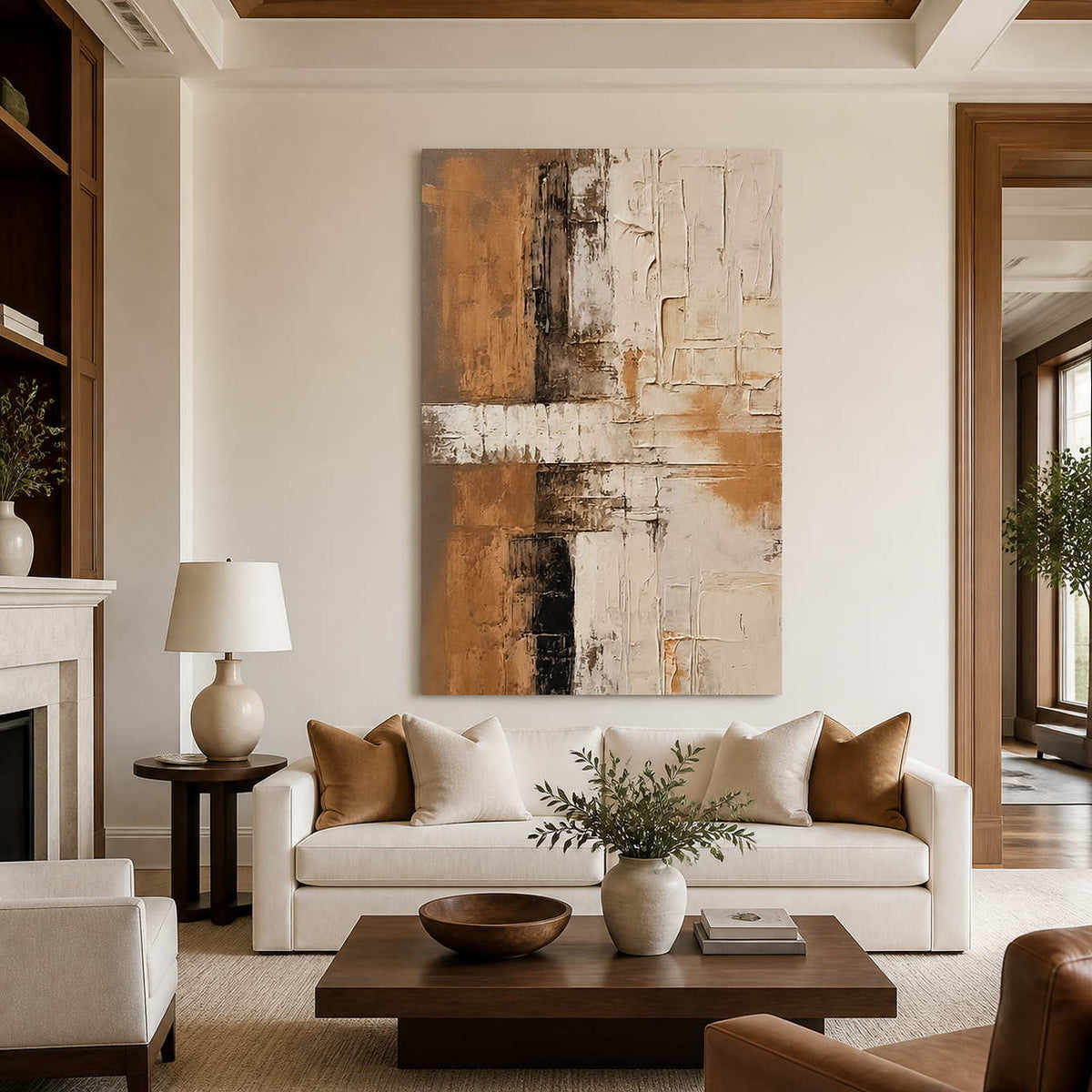 Warm abstract wall art above a cream sofa beside a stone fireplace.