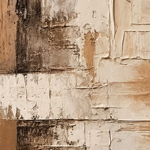 Close-up of raised cream ridges and scraped brown layers in abstract wall art.