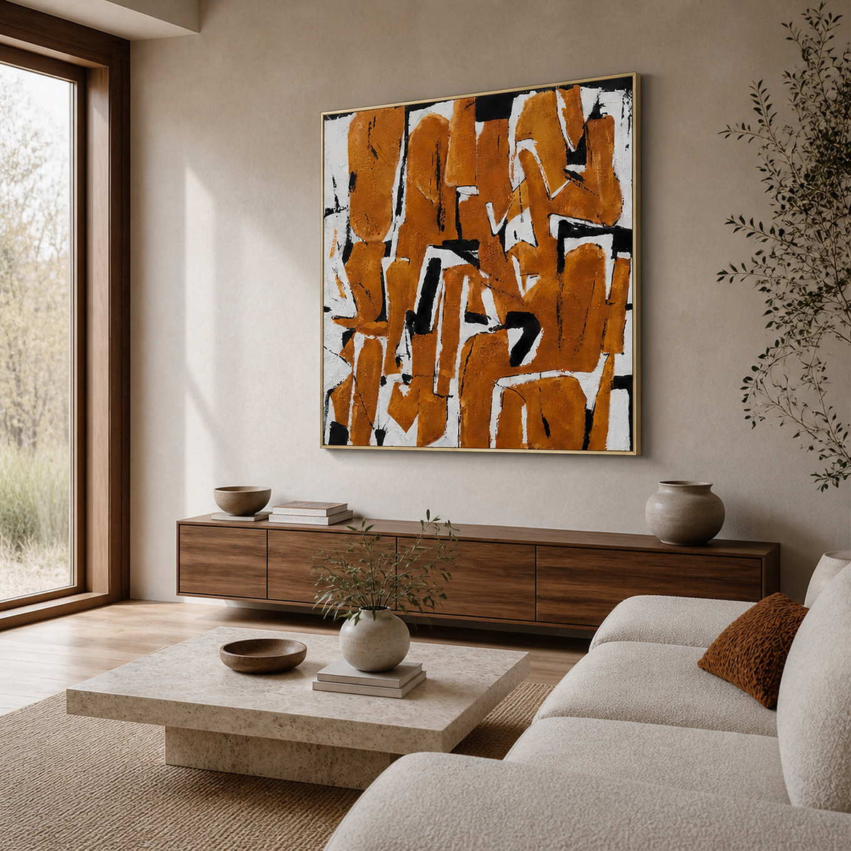 An Eager Embrace in a gold frame above a wood sideboard, bringing warm ochre strokes to a sunlit living room.