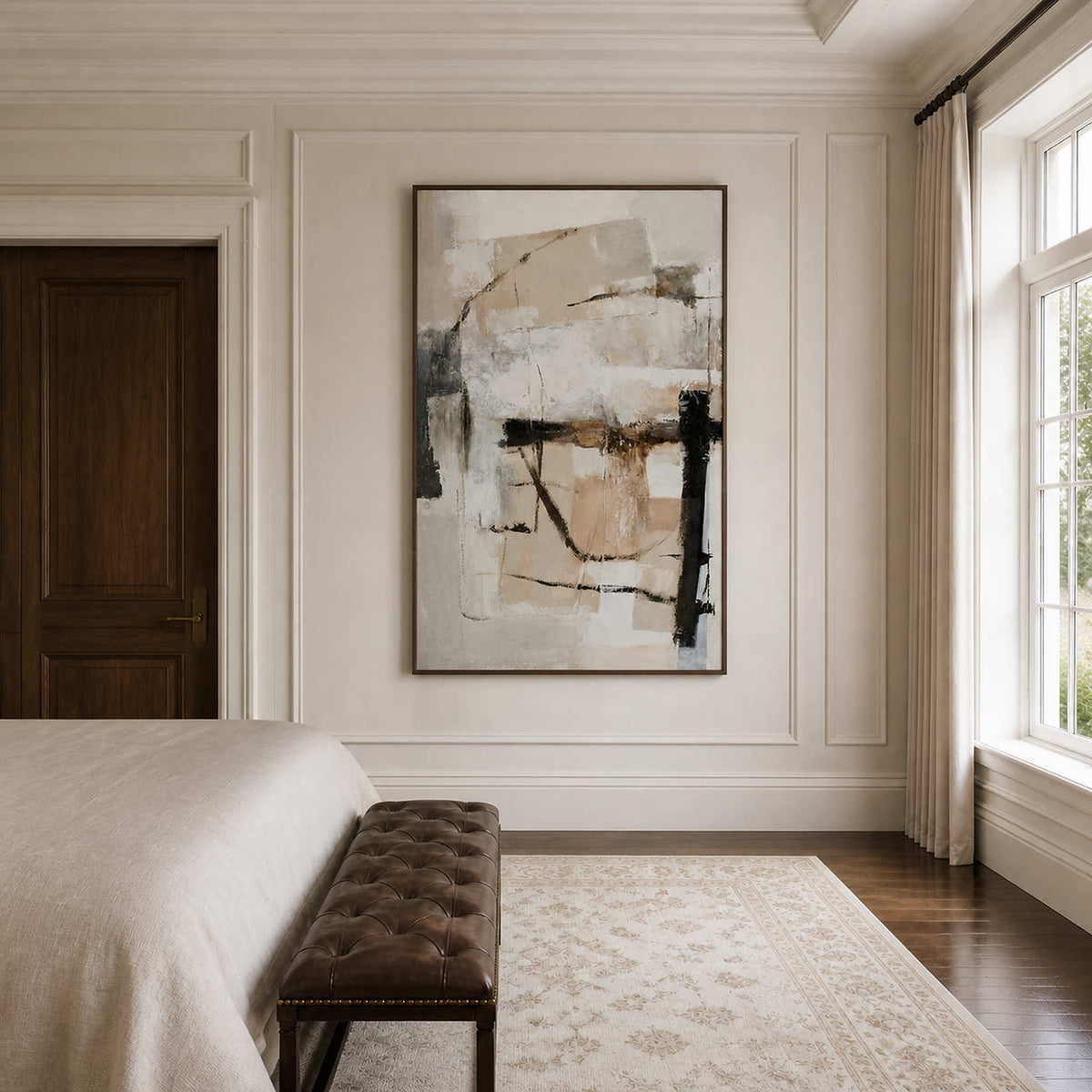 Wood framed neutral abstract artwork beside a bed and brown leather bench in daylight.