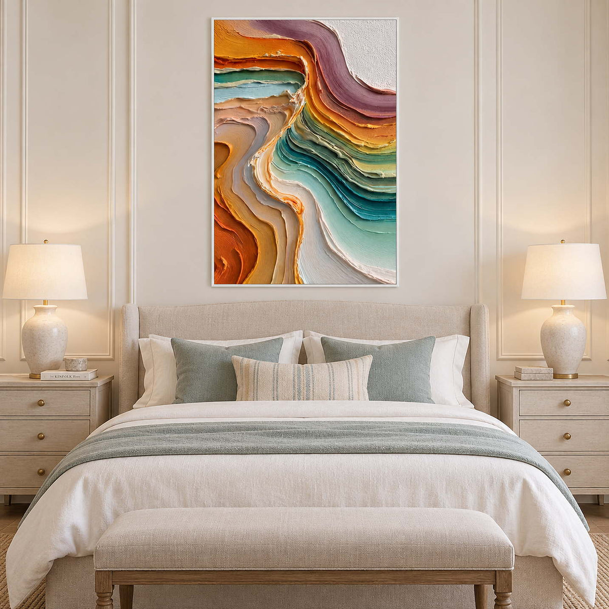 White-framed curved-band artwork above a pale bed with muted aqua pillows.