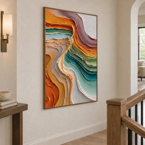 Angled view of the tall abstract painting beside a wood stair rail and arched doorway.