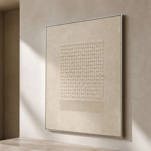 Sculptural ivory artwork viewed from the side in a quiet entry gallery.