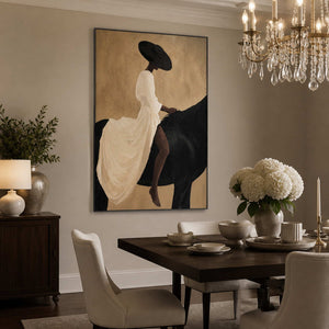 Black framed equestrian painting beside white flowers in an elegant dining room.