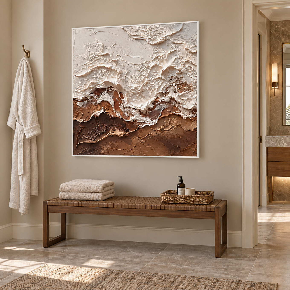 At Ease in a white frame above a wood bench holding folded towels and a basket in a bathroom dry area.