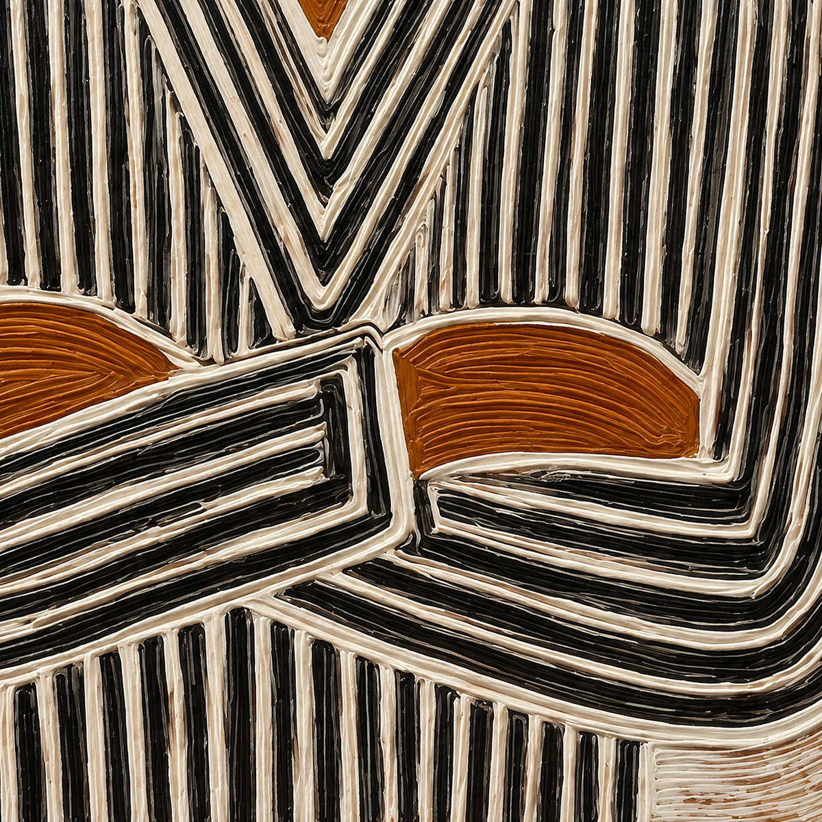 Detail of ochre hands and black-and-cream grooved stripes crossing at the figure's forearms.