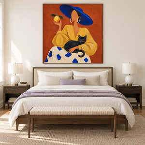 Orange cat-and-figure artwork above a neutral bed with a bench.