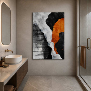 Frameless orange and monochrome abstract artwork beside a vessel sink and glass bathroom shower.