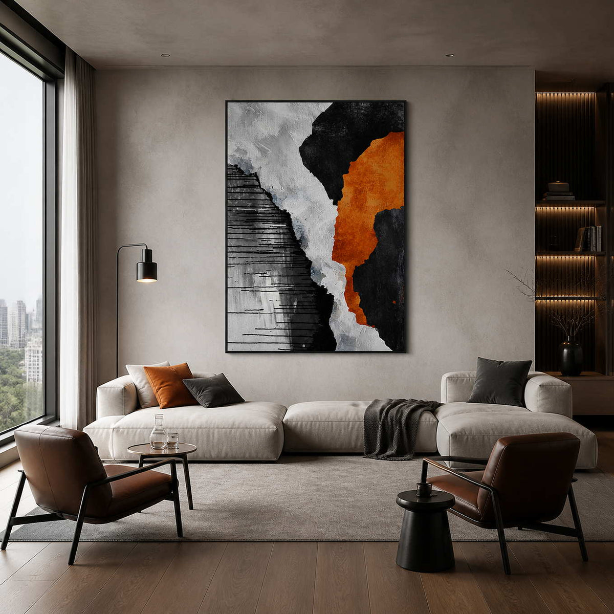 Black framed orange and monochrome abstract artwork above a pale sofa beside city-facing windows.